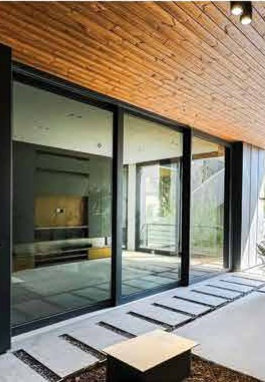 Sliding glazing opening to an exterior deck