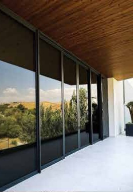 Sliding glazing beneath timber
